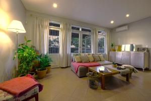 a living room with a couch and a table at Boutique Vineyard and Wine Lodge in Maipú