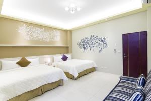 Ένα ή περισσότερα κρεβάτια σε δωμάτιο στο Mu Yu B&B