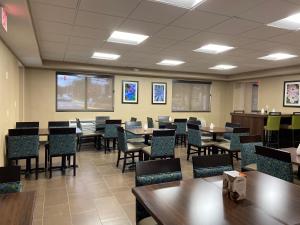 a classroom with tables and chairs in a room at Comfort Inn Herndon-Reston in Herndon