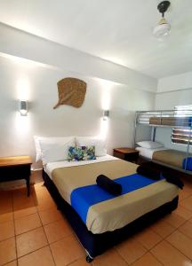 Voodi või voodid majutusasutuse Oasis Palms Hotel toas