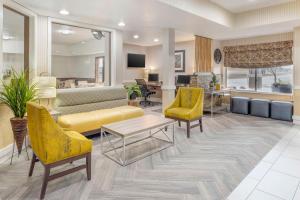 a living room with a couch and chairs and a table at Best Western Celina in Celina