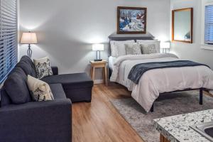 a bedroom with a bed and a couch at Champagne Supernova in Ludlow