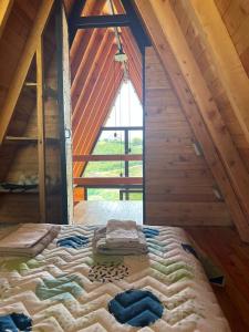 Postel nebo postele na pokoji v ubytování Cabaña Starka & Jacuzzi