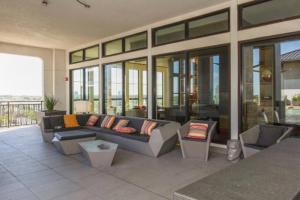 a living room with a couch and chairs in a building at The Bentler #1 in Houston