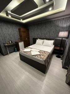 a bedroom with a large bed in a room at Loft Suite Residence in Bursa