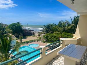 a view of the beach from the balcony of a resort at Hotel La Tolita in Atacames