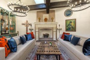 a living room with a couch and a fireplace at Casa Almira 5BR Luxury Home with Pool, Hot Tub & Rooftop in San Miguel de Allende +58 photos