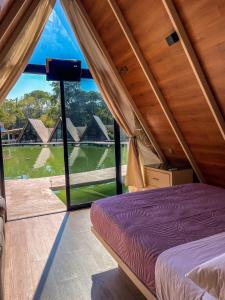 Postel nebo postele na pokoji v ubytování RIO HOTEL Y GLAMPING + 12 fotografií