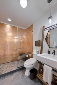 a bathroom with a toilet and a sink and a shower at The Tannery in Lancaster +32 photos