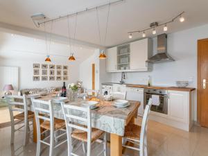 a kitchen and dining room with a table and chairs at Chalet Mountain View in Alpbach