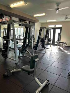 a gym with several tread machines in a room at The Bentler #2 in Houston