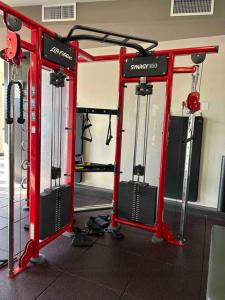 a gym with four machines in a room at The Bentler #2 in Houston