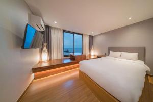 Postel nebo postele na pokoji v ubytování Two Y Hotel