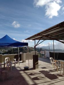 a group of chairs and umbrellas on a roof at EMILIEZ PLACE in Baguio