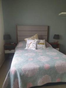 Llit o llits en una habitació de Casa llena de vida y buena vibra con las amenidades necesarias para que pases una estancia de 10!