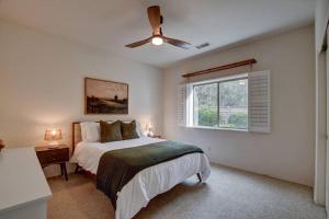 a bedroom with a bed and a ceiling fan at Sedona Retreat W/ Tesla Mobile Charger in Sedona