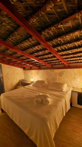 a bedroom with a large white bed in a room at Tritón Hotel Boutique & Restaurant in Guayacanes +49 photos