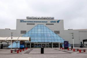 a building with a pyramid shaped roof with benches in front at Entire Apartment - Excel Exhibition Centre O2 Arena London Royal Victoria Canning Town in London