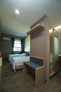 Postel nebo postele na pokoji v ubytování Regent Hotel