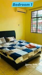 a bed sitting in a room with at Samma HomeStay Double Storey Terrace House in Kota Kinabalu