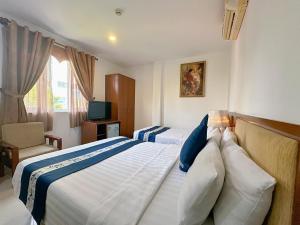 Postel nebo postele na pokoji v ubytování Ruby Star Hotel- Near Bến Thành Market