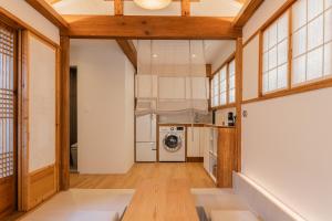 a kitchen with a washer and dryer in a room at Luxury Hanok Stay Nuri in Seoul