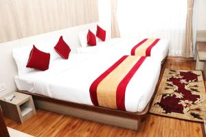 Una cama o camas en una habitación de Hotel Prime Suite