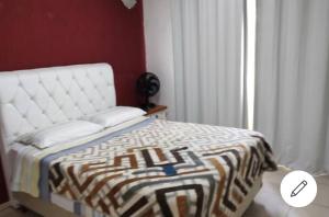 A bed or beds in a room at Casa Térrea Oliveira inteira