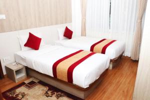 Una cama o camas en una habitación de Hotel Prime Suite