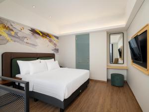 Luminor Hotel Padjadjaran Bogor by WH房間的床