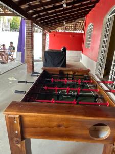 a pool table with red balls in a room at Espaço perainda in Boa Vista