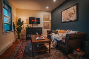 a living room with a couch and a table at The Willow, Catskill in Catskill
