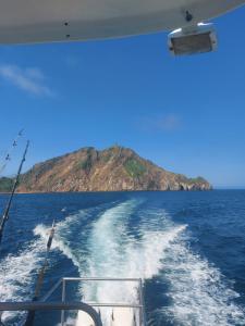 a view from the back of a boat in the ocean at Flor's House in San Cristobal