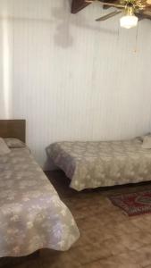 Кровать или кровати в номере Casa Maria frente al mar
