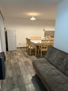 a living room with a couch and a table at El rincon de Valle in Valle Hermoso