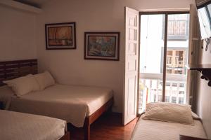Krevet ili kreveti u jedinici u objektu Hotel Raíces Casona Real