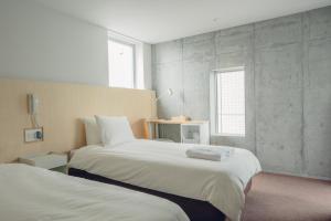 Postel nebo postele na pokoji v ubytování DOMO Hotel
