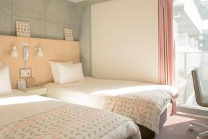 Postel nebo postele na pokoji v ubytování DOMO Hotel