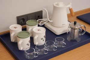 a tray with glasses and a blender on a counter at Hotel Ground27 in Busan