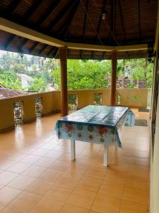 a table in the middle of a room at Delight Homestay in Ahangama