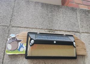 a solar meter sitting on the side of a building at grori house in Musashino +7 photos