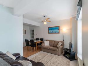 a living room with a couch and a table at 2 Bed in Tenby 83211 in Tenby
