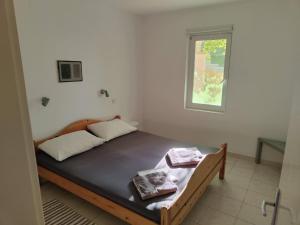 Ένα ή περισσότερα κρεβάτια σε δωμάτιο στο Apartments Var - with nice garden