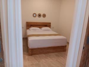 Postel nebo postele na pokoji v ubytování Manuh Guest House