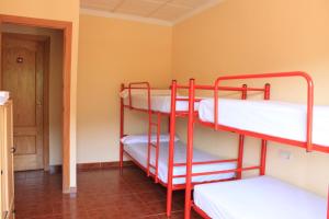 Postel nebo postele na pokoji v ubytování Albergue Los Chorros