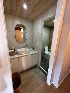 a bathroom with a sink and a mirror at Jahayeon Hanokstay in Jeonju