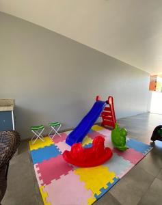 a childs play area with a toy playground at Recanto da Natureza & SPA in Penha