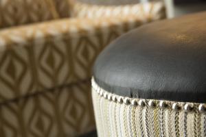 a close up of a stool with a leather seat at Crowne Plaza Chicago SW - Burr Ridge, an IHG Hotel in Burr Ridge
