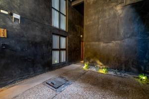 an empty room with lights on the floor of a building at The Teodoro in Tulum