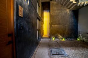 an empty hallway with a yellow door in a building at The Teodoro in Tulum